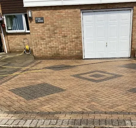 Clean block paved driveway with diamond pattern after pressure washing