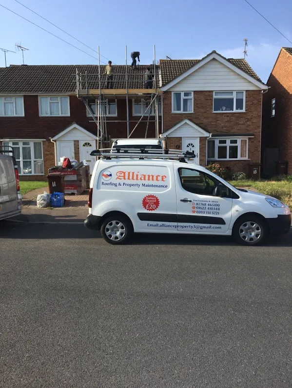 Alliance Roofing team fitting a new roof on a Kent house, with scaffolding and company van