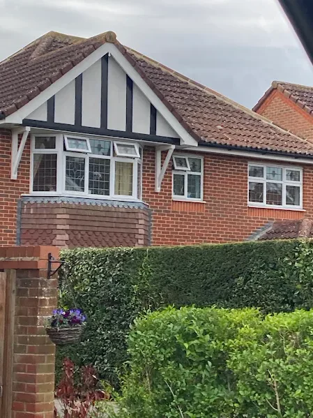 Tudor style gable and tiled roof on a red brick Kent home