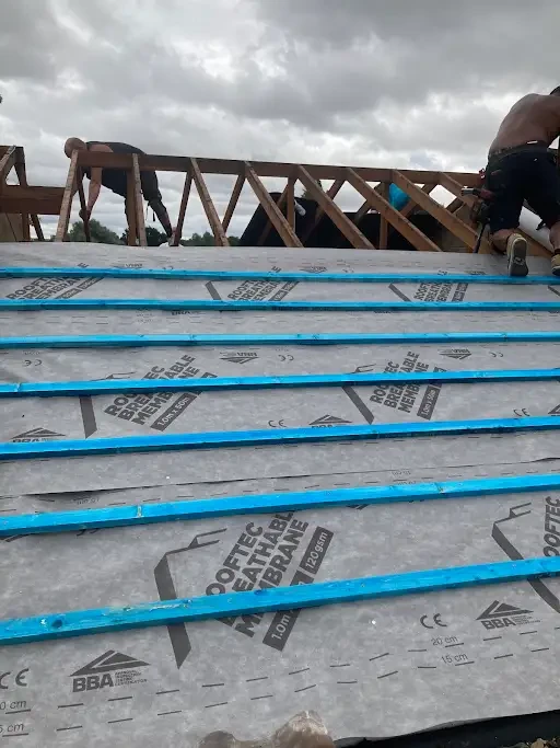 Breathable roof membrane and blue battens fitted during a new roof installation