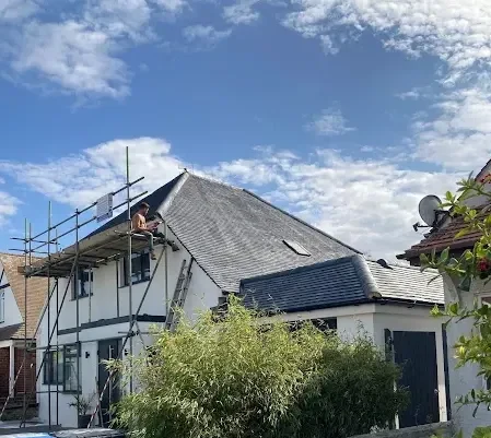 Render Repairs: New roof tiles being installed on a Kent home from scaffolding